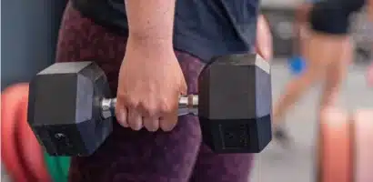 woman holding dumbbells strength ambassadors