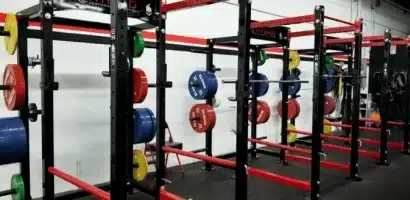 a wall of barbell wracks